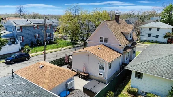 an aerial view of a house with a garden