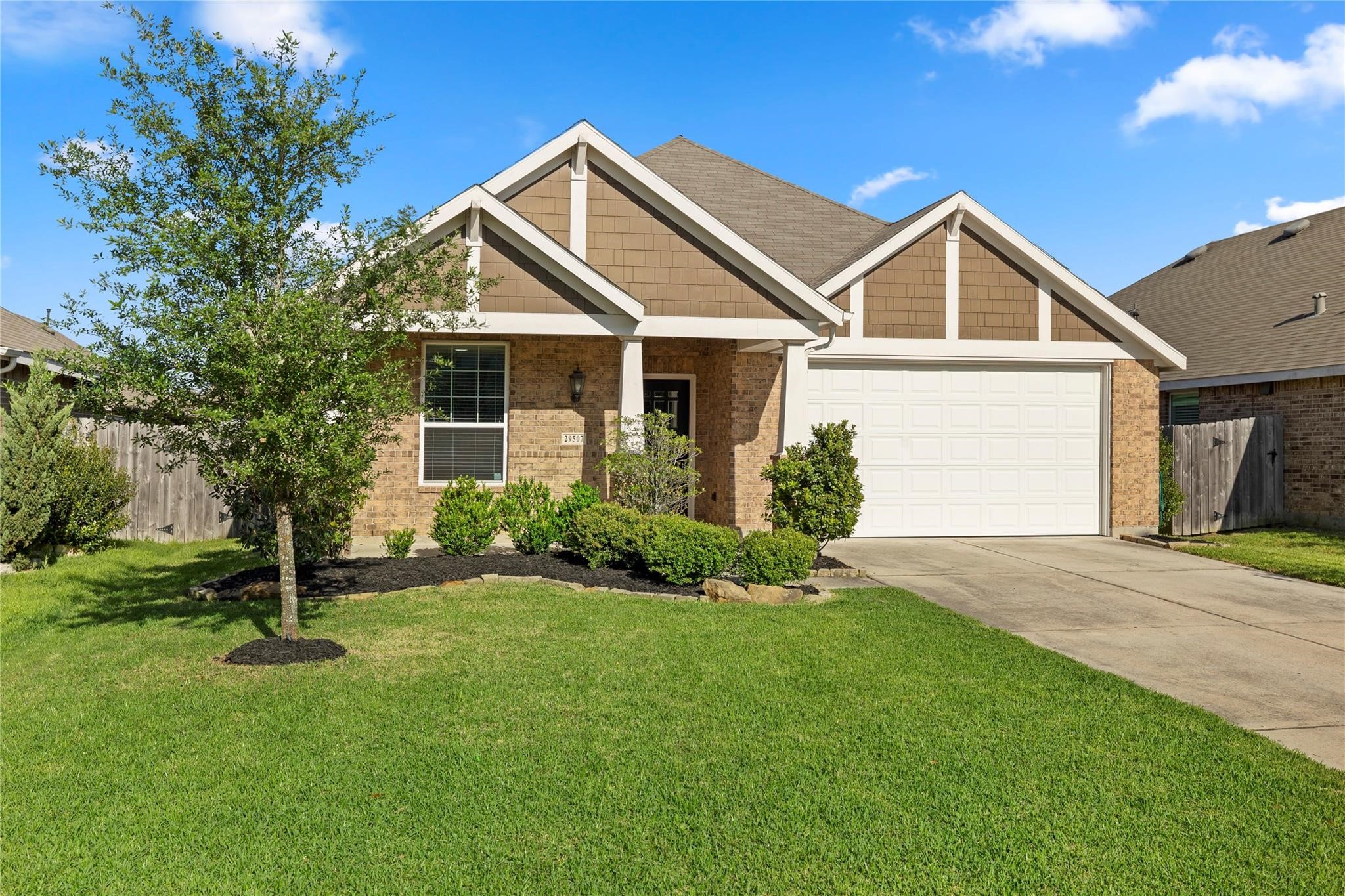 29507 Whitebrush Trace Drive Spring, TX 77386 - Photo 31 of 32 Front exterior view with driveway, garage, and front lawn.