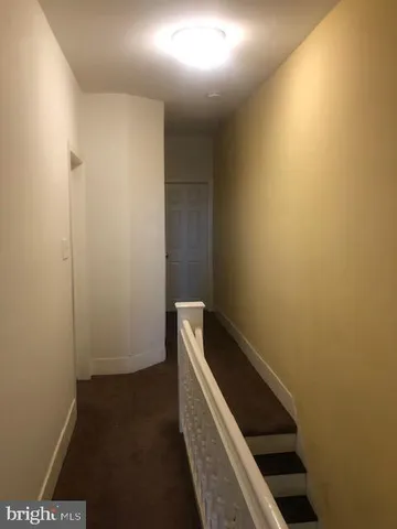 a white toilet sitting next to a window