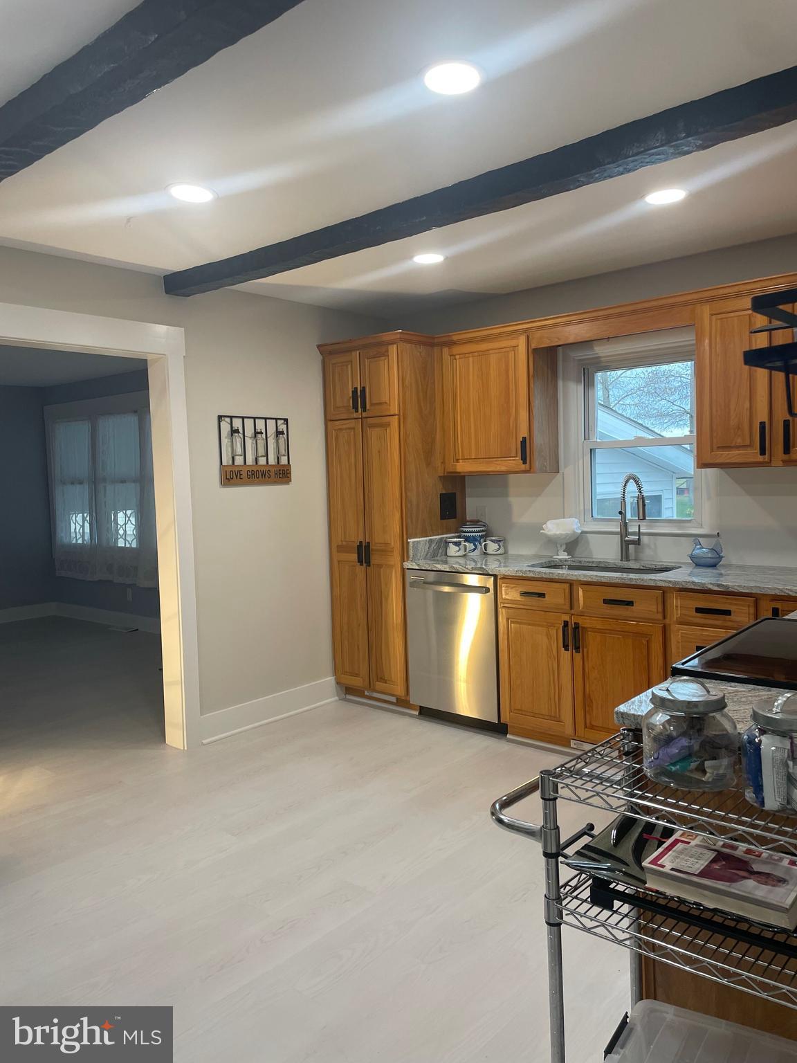 3 Talbot Avenue Cambridge, MD 21613 - Photo 12 of 17 a kitchen with stainless steel appliances granite countertop a sink stove and refrigerator