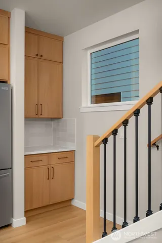 a view of a hardwood & utility room