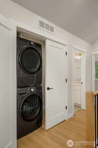 a view of a bedroom with washer and dryer