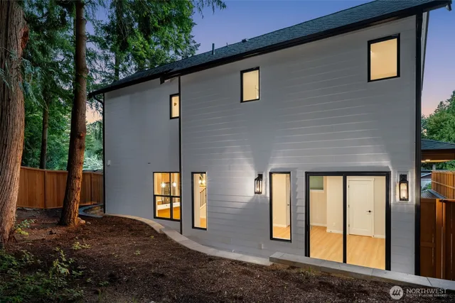 a front view of a house with large windows