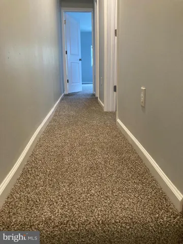 an empty room with a bench