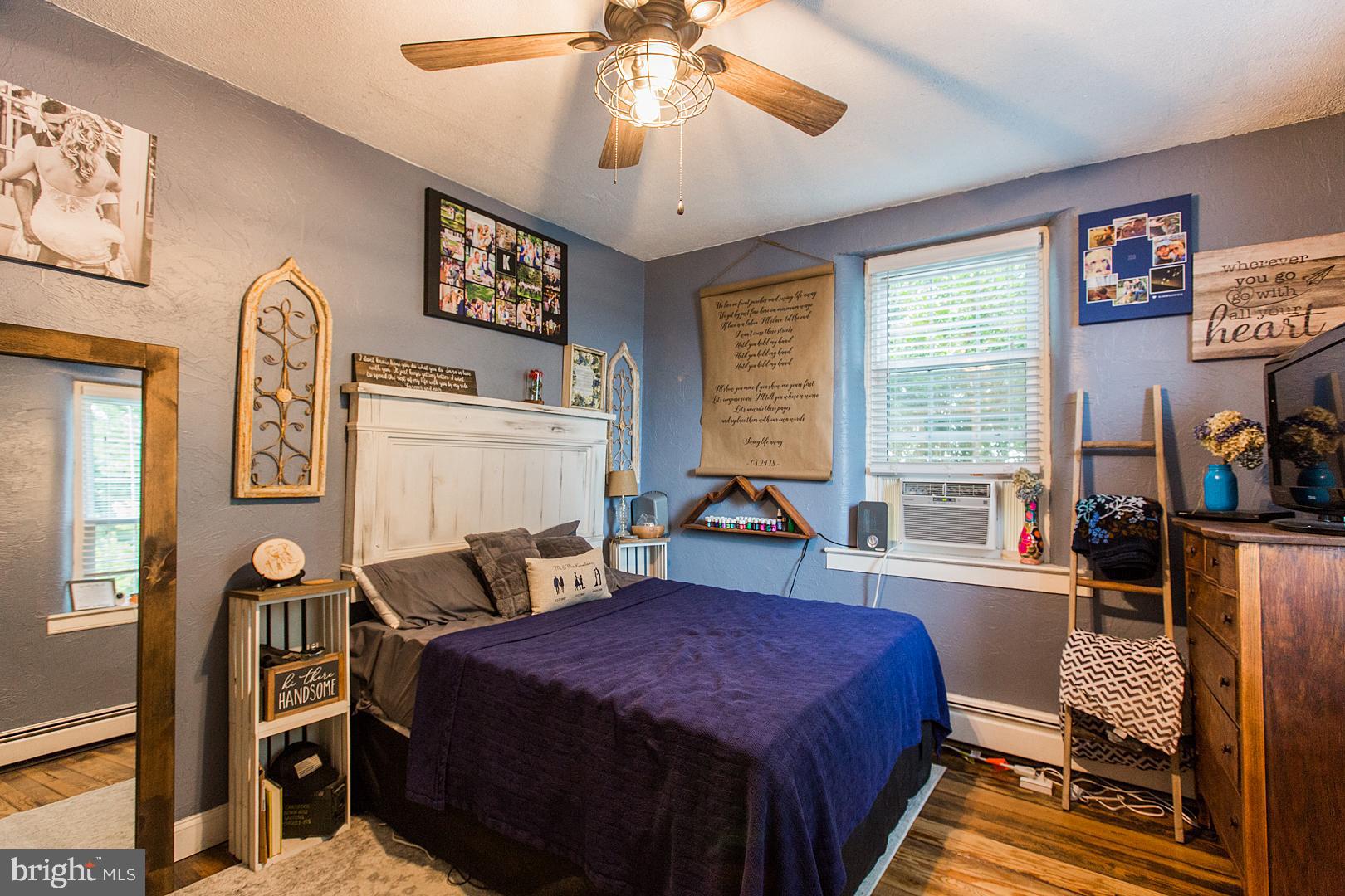 317 West Meadow Valley Road Lititz, PA 17543 - Photo 25 of 59 a bed room with a bed and a chandelier