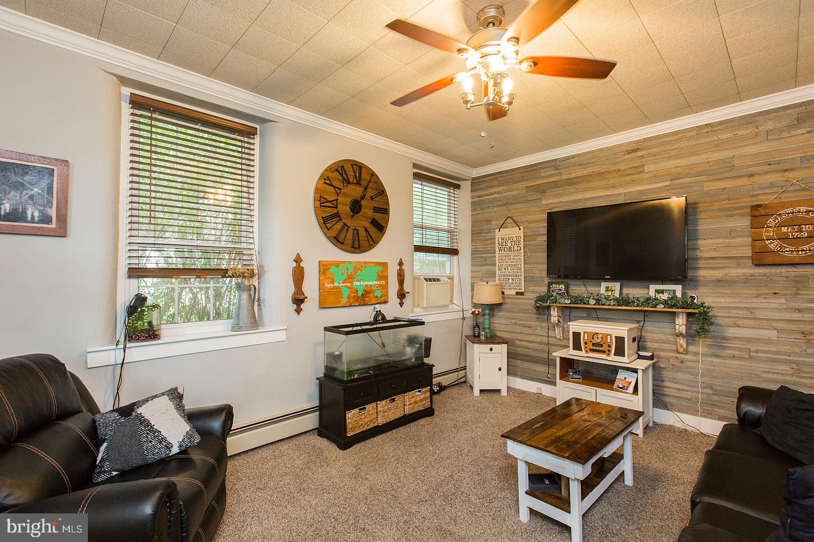 317 West Meadow Valley Road Lititz, PA 17543 - Photo 33 of 59 a living room with furniture and a flat screen tv