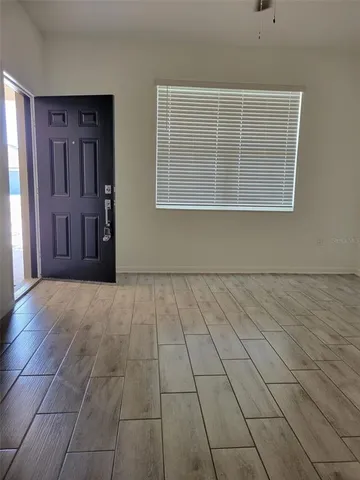 a view of an empty room with a window