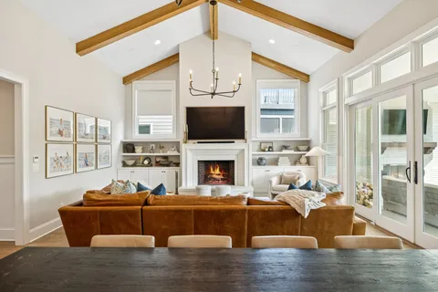 a bedroom with a large bed and a large window