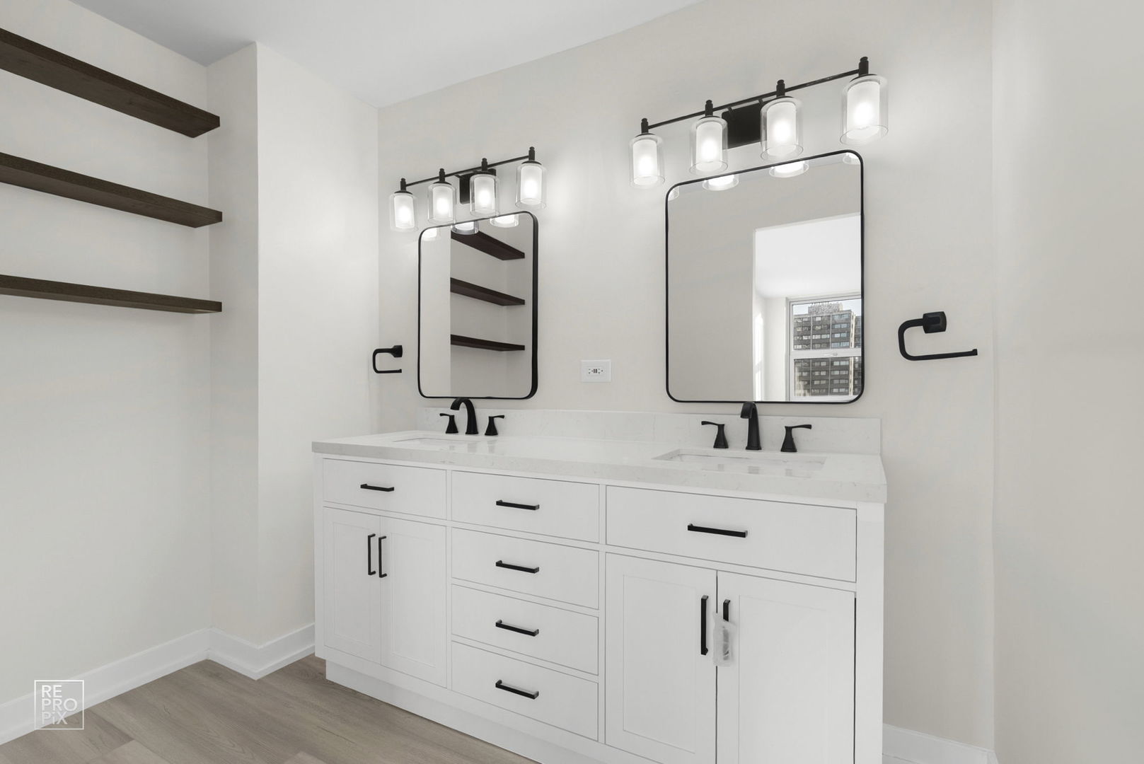 6147 North Sheridan Road, Unit 7A Chicago, IL 60660 - Photo 7 of 14 a bathroom with a double vanity sink and mirror