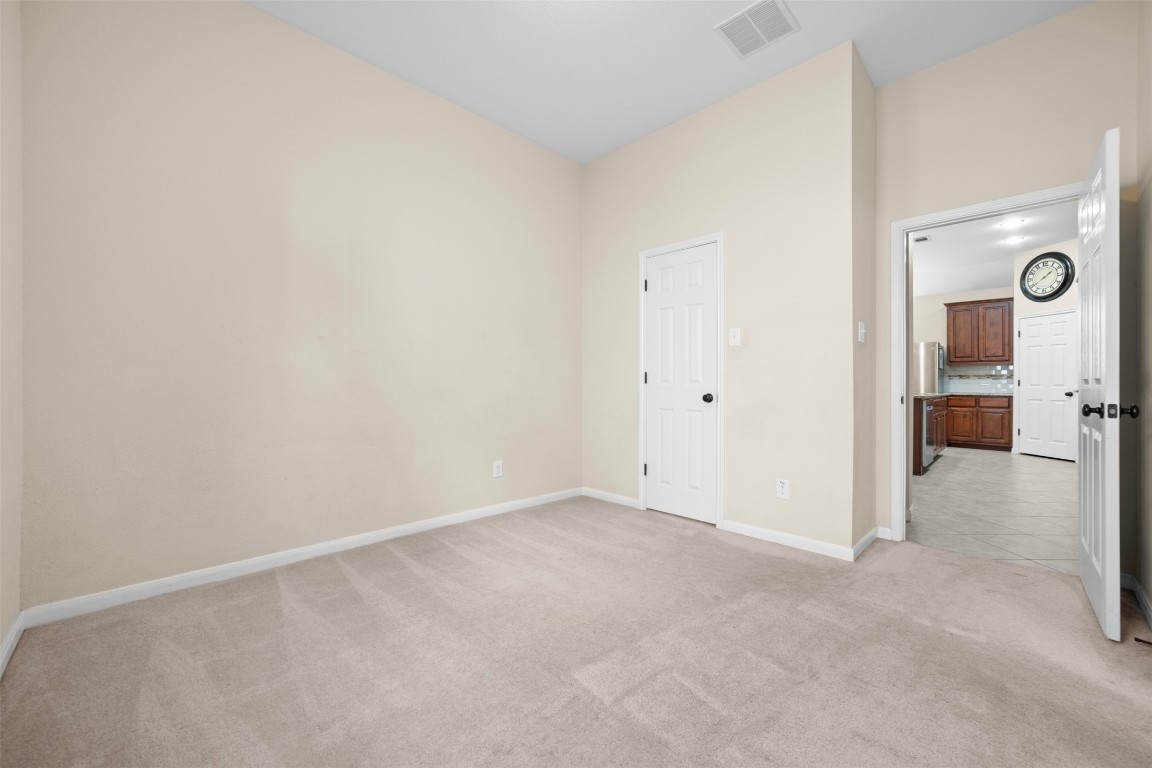 216 Archipelago Trail Austin, TX 78717 - Photo 19 of 40 Unfurnished bedroom featuring light colored carpet and baseboards