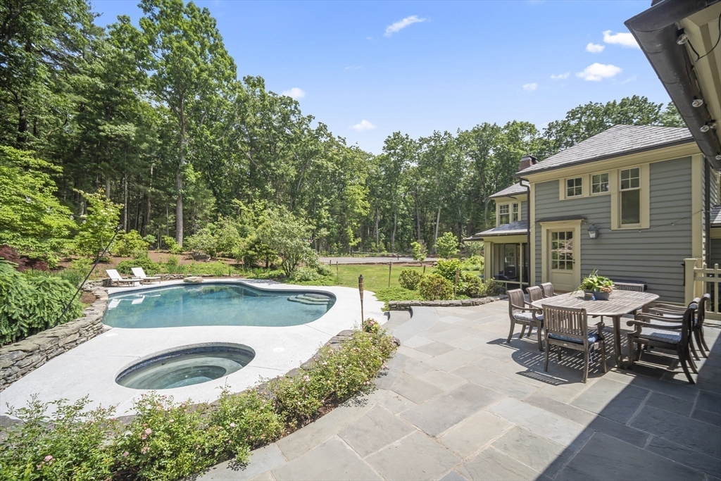52 Goodnow Road Sudbury, MA 01776 - Photo 6 of 42 a view of a backyard with sitting area and garden