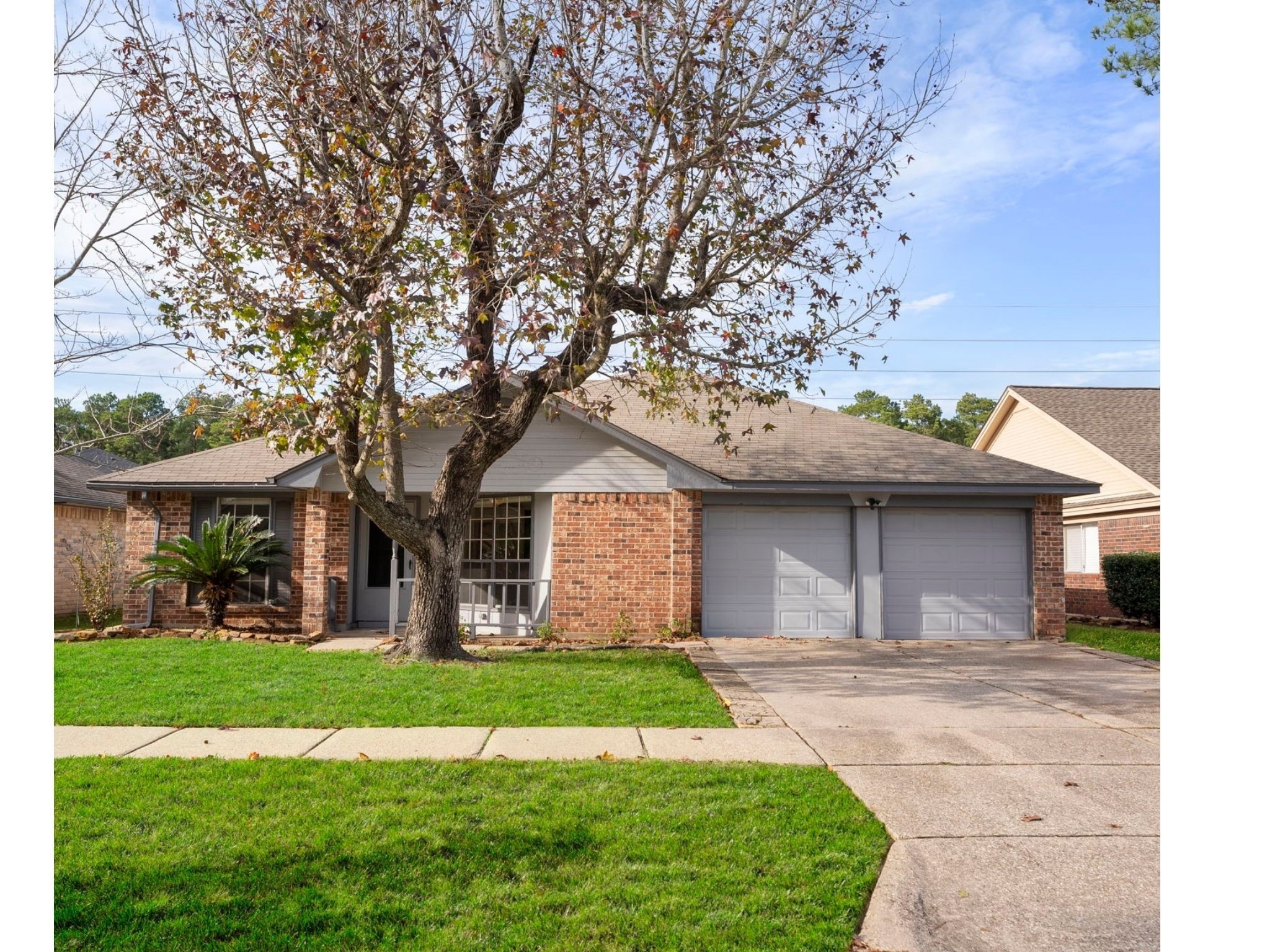 5114 Aberton Lane Spring, TX 77379 - Photo 1 of 31 a front view of a house with garden