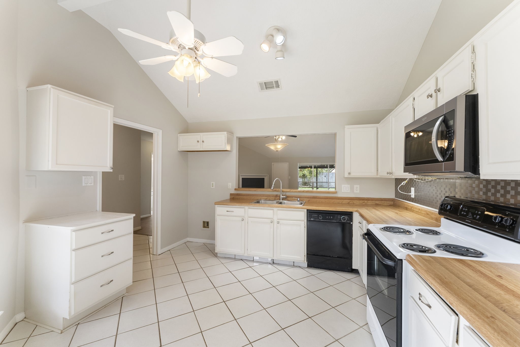5114 Aberton Lane Spring, TX 77379 - Photo 13 of 31 a kitchen with granite countertop cabinets stainless steel appliances and a counter space