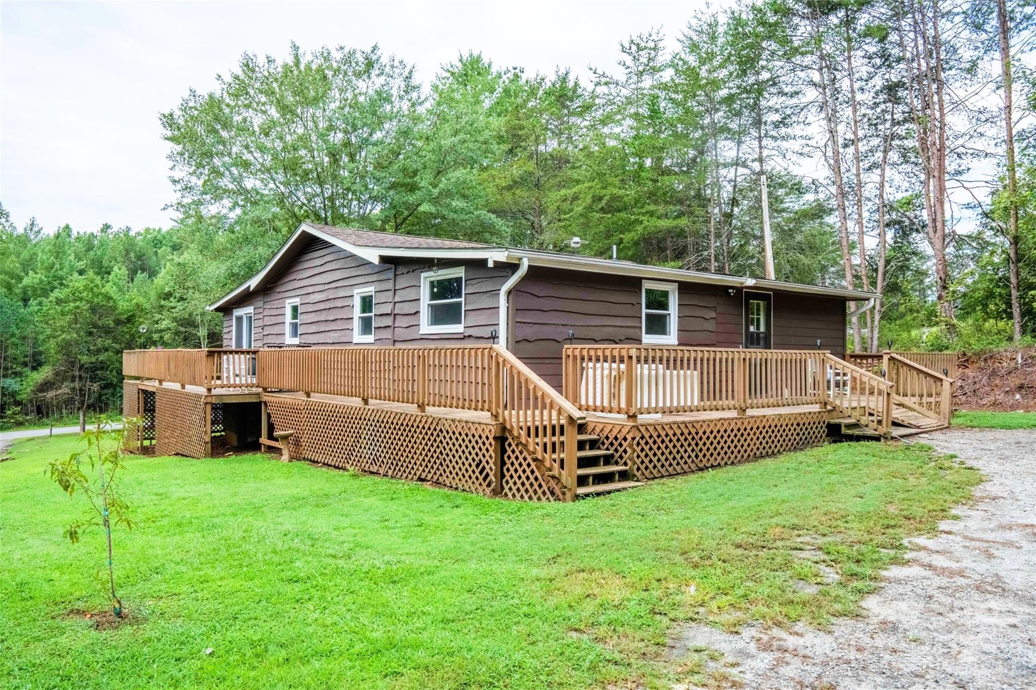 4420 Highway 64 Rutherfordton, NC 28139 - Photo 1 of 35 a view of a house with a yard and sitting area