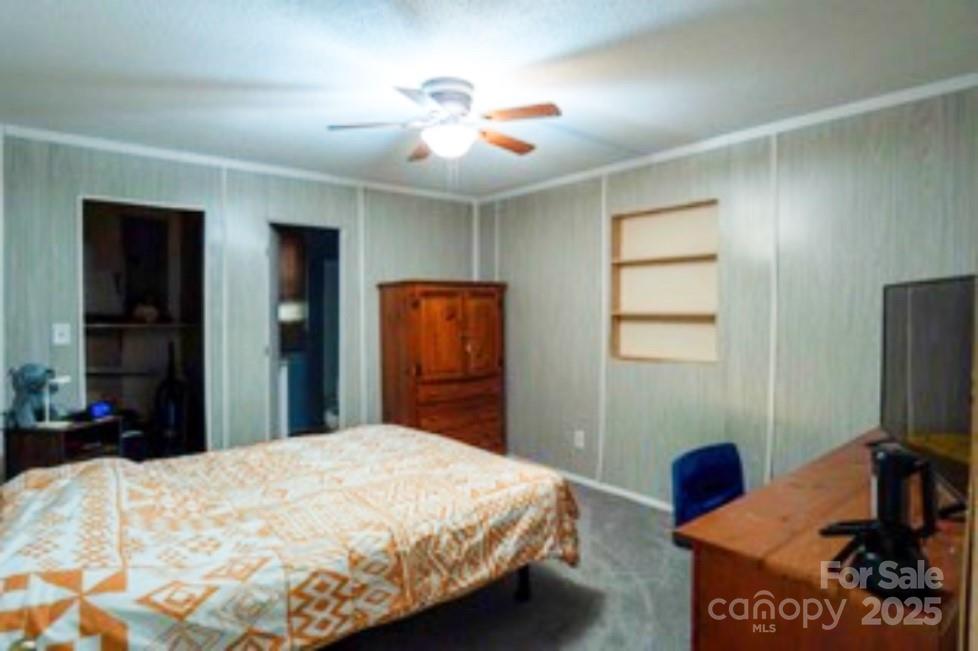 4420 Highway 64 Rutherfordton, NC 28139 - Photo 19 of 35 a bedroom with a bed and a flat screen tv