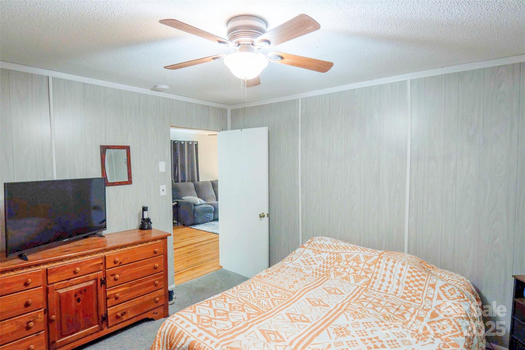 4420 Highway 64 Rutherfordton, NC 28139 - Photo 20 of 35 a bedroom with a bed and a flat screen tv