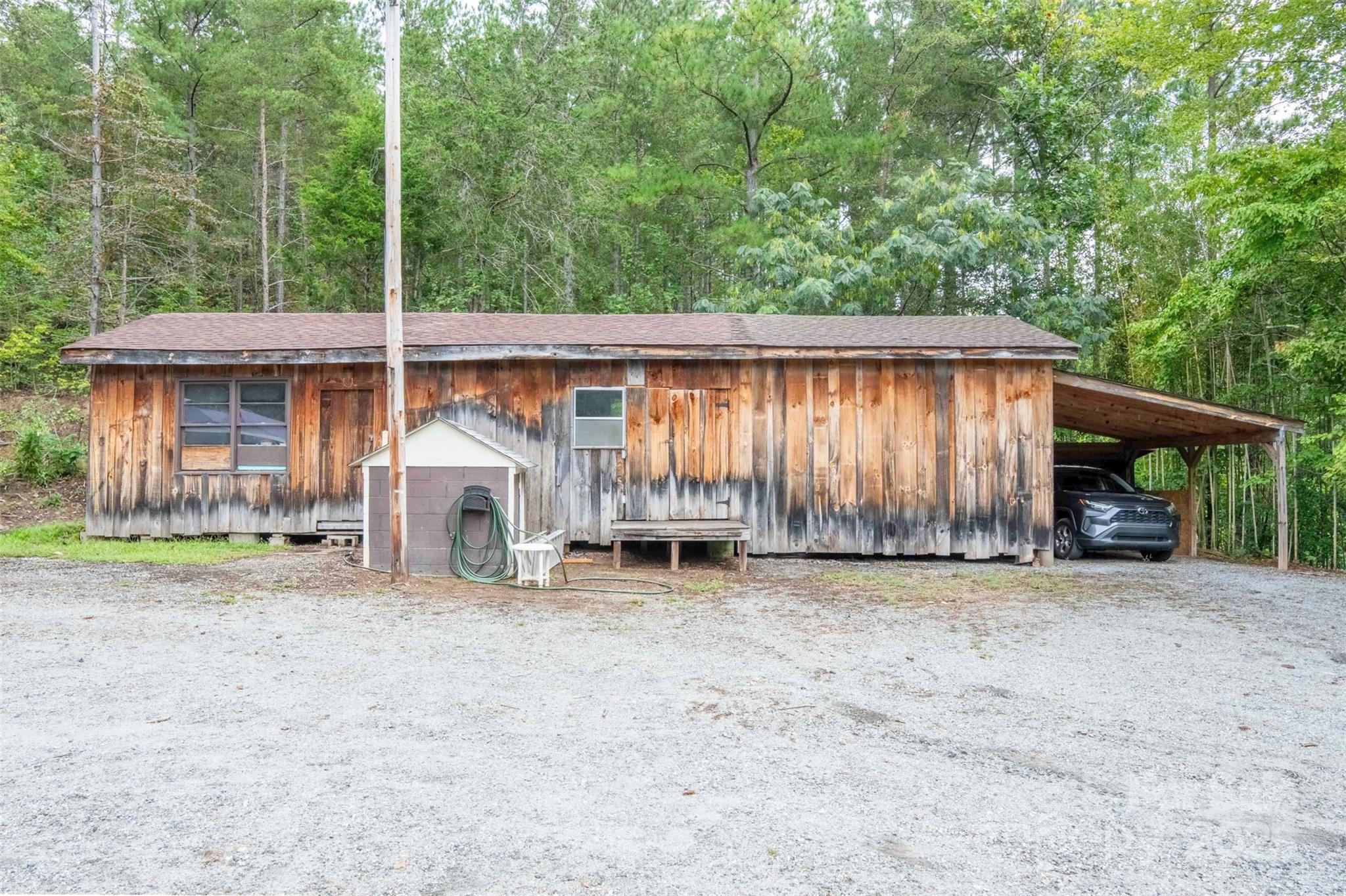 4420 Highway 64 Rutherfordton, NC 28139 - Photo 35 of 35 a view of a house with a yard and roof