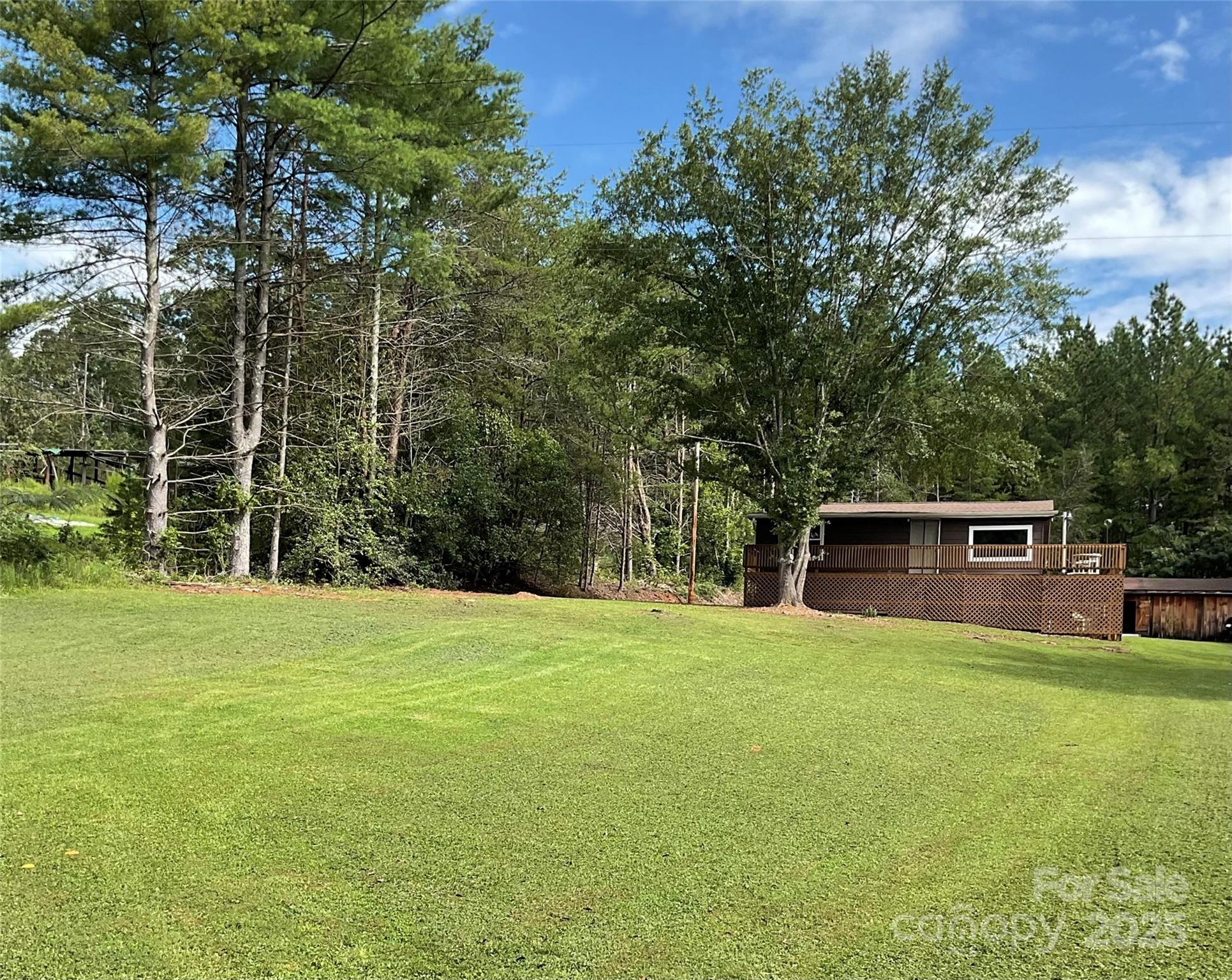 4420 Highway 64 Rutherfordton, NC 28139 - Photo 6 of 35 a backyard of a house with table and chairs