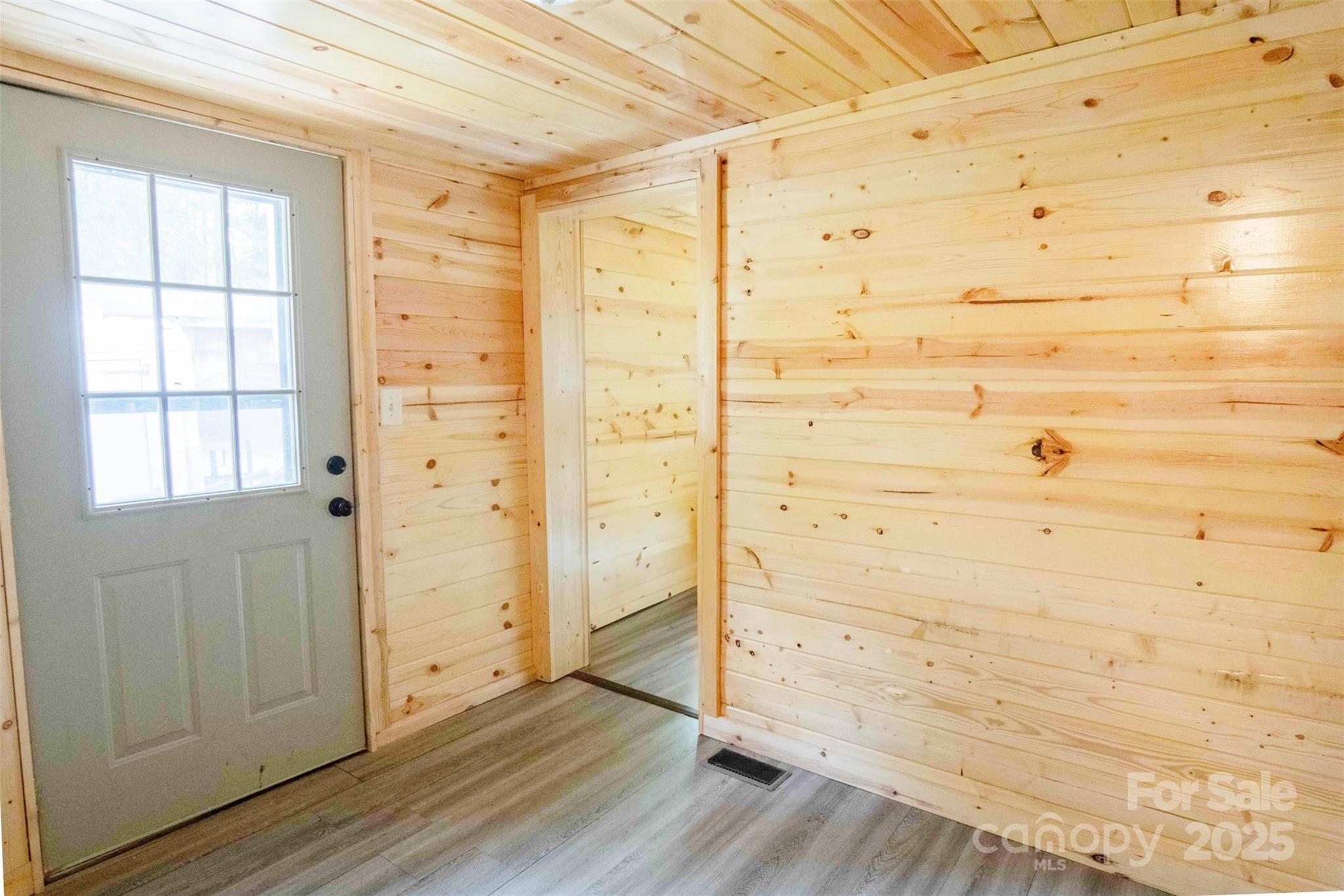 4420 Highway 64 Rutherfordton, NC 28139 - Photo 7 of 35 a view of empty room with wooden floor and cabinet