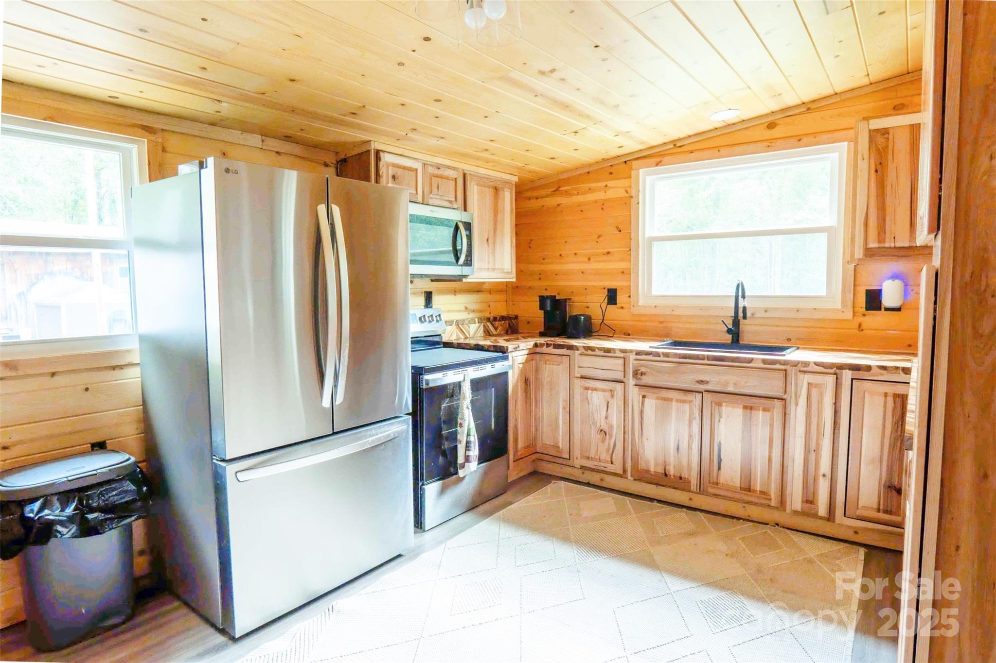 4420 Highway 64 Rutherfordton, NC 28139 - Photo 9 of 35 a kitchen with stainless steel appliances granite countertop a refrigerator a sink and a stove