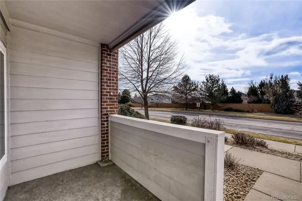 a view of a terrace with yard and mountain view