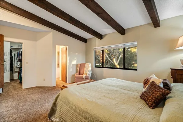 a view of a livingroom with workspace and a couch