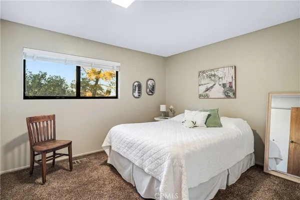 a living room with furniture and a ceiling fan