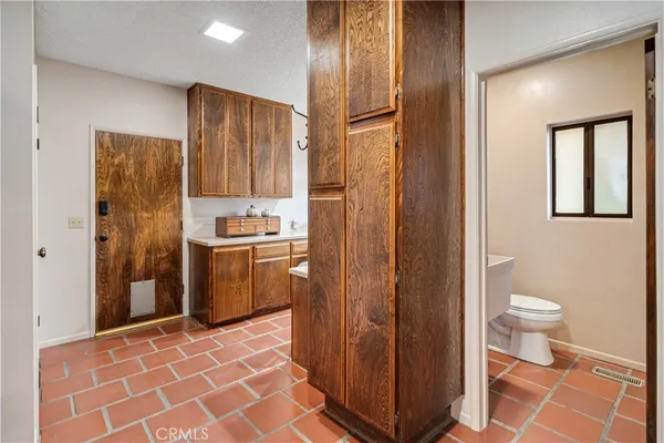 a kitchen that has a sink and a stove in it