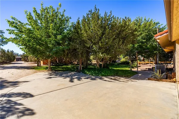 a view of a livingroom with furniture and a kitchen