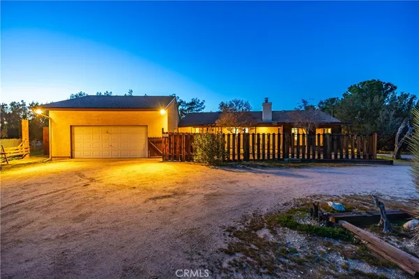 a kitchen with stainless steel appliances granite countertop a sink a refrigerator and a granite counter tops