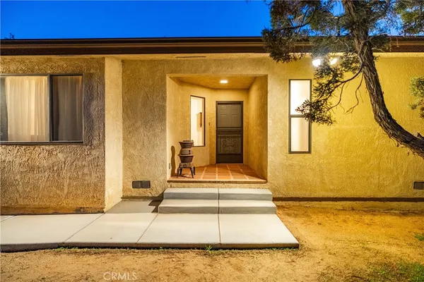 a kitchen with stainless steel appliances a refrigerator and a stove top oven