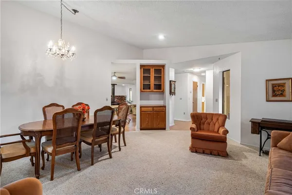 a bedroom with a bed chair and a window
