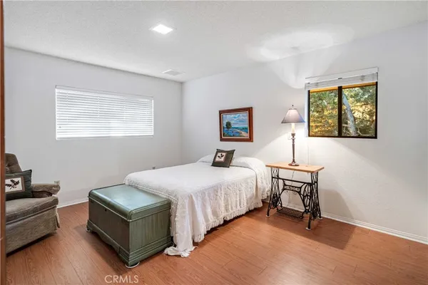 a view of a patio with a table and chairs under an umbrella