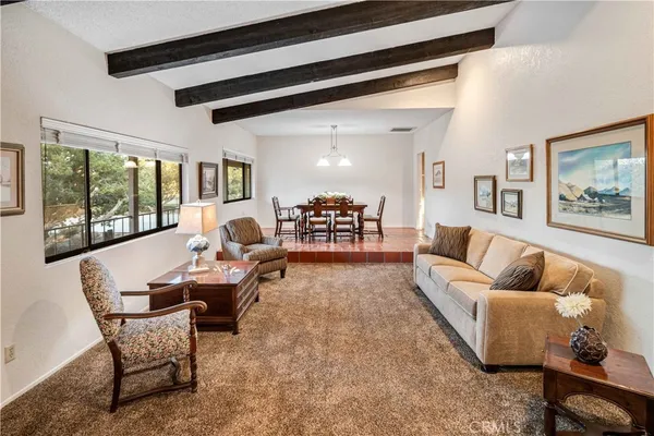 a dining area with a table and chairs