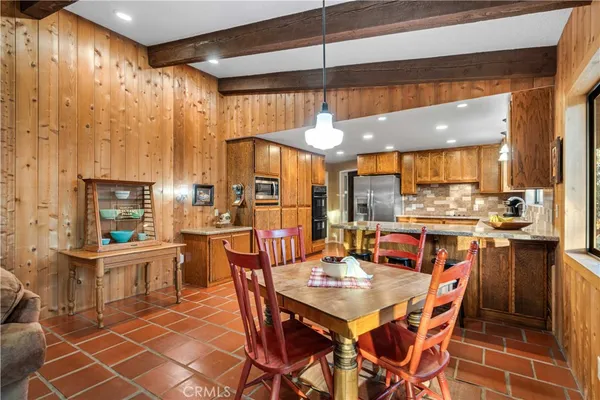 a spacious bedroom with a bed and glass window