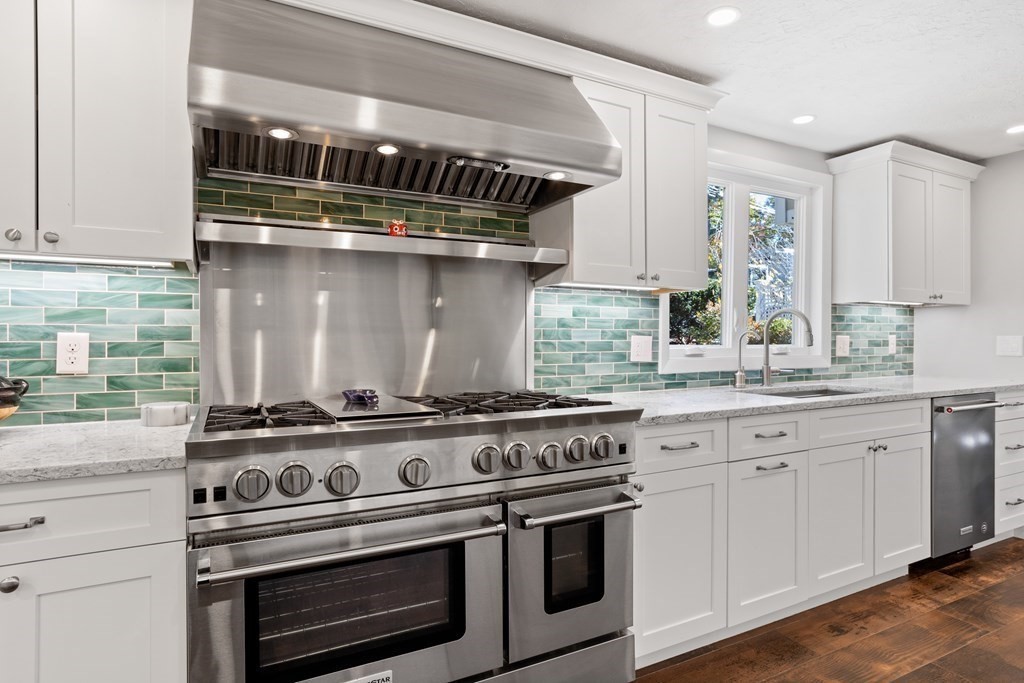 30 Davis Road Stow, MA 01775 - Photo 11 of 42 a kitchen with a stove top oven and cabinets