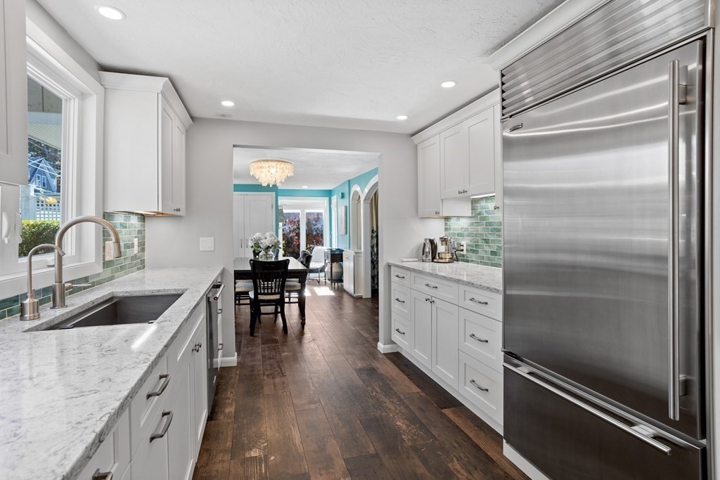 30 Davis Road Stow, MA 01775 - Photo 12 of 42 a kitchen with white cabinets and stainless steel appliances