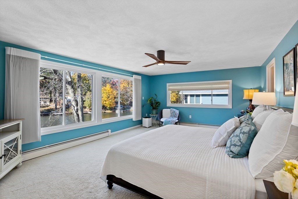 30 Davis Road Stow, MA 01775 - Photo 26 of 42 a bedroom with a large bed and a large window