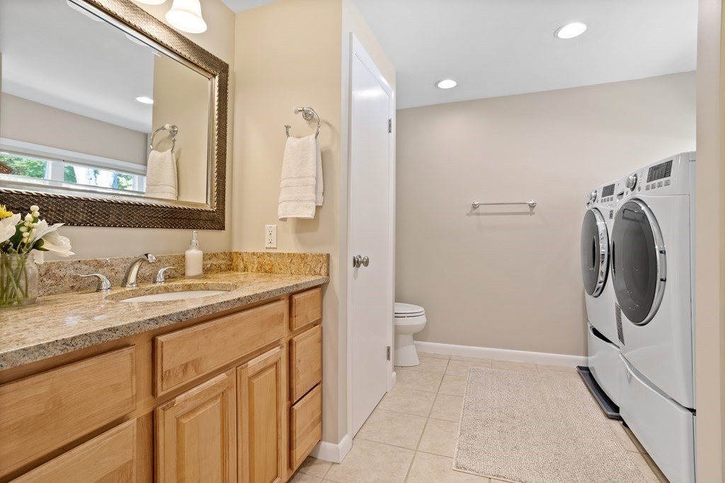 30 Davis Road Stow, MA 01775 - Photo 32 of 42 a bathroom with a granite countertop sink toilet and shower