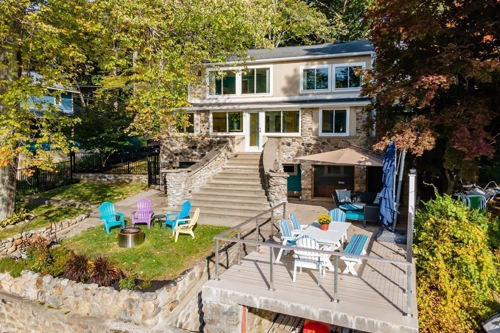 30 Davis Road Stow, MA 01775 - Photo 41 of 42 a view of a patio with table and chairs and potted plants