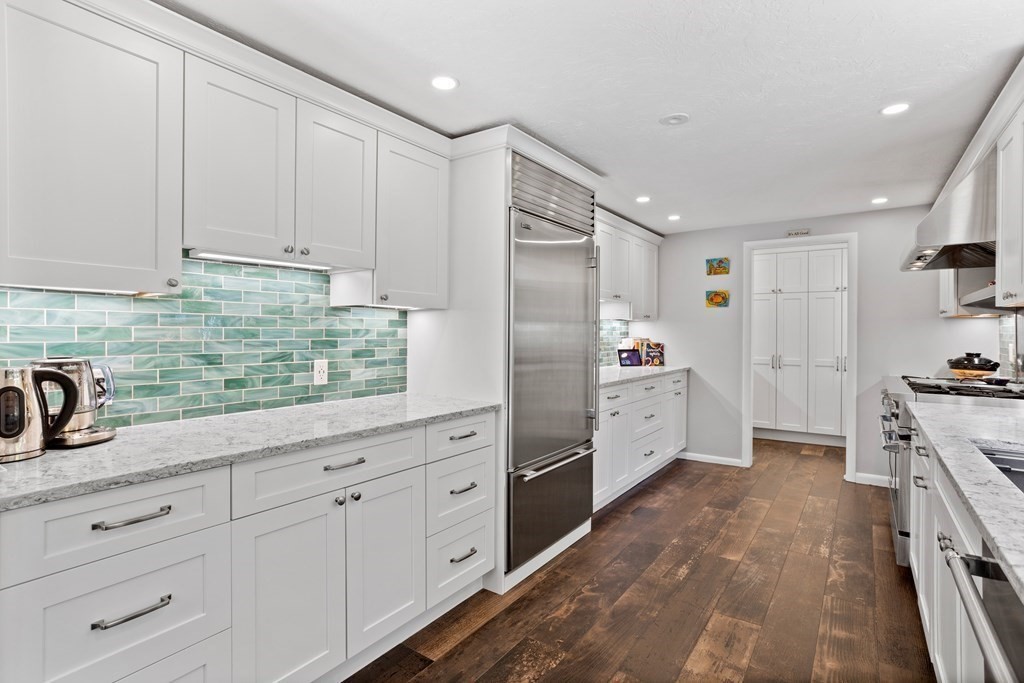 30 Davis Road Stow, MA 01775 - Photo 9 of 42 a kitchen with white cabinets and white appliances
