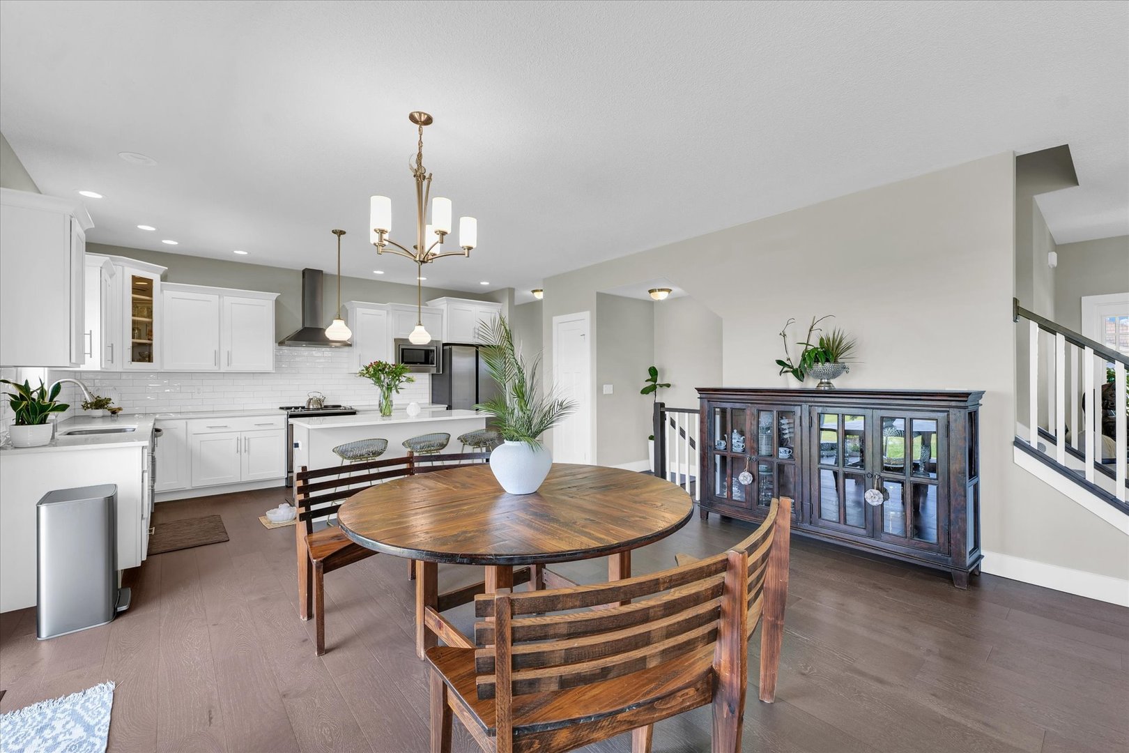 1908 Littlefield Lane Mahomet, IL 61853 - Photo 11 of 51 a dining room with furniture a chandelier and wooden floor