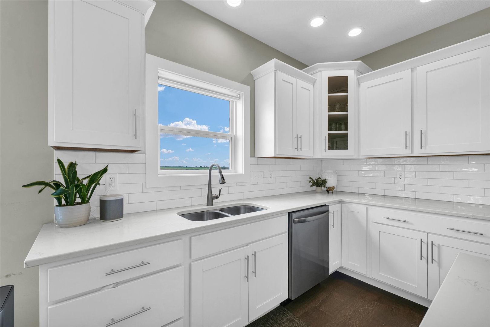 1908 Littlefield Lane Mahomet, IL 61853 - Photo 15 of 51 a kitchen with white cabinets a sink and dishwasher next to a window
