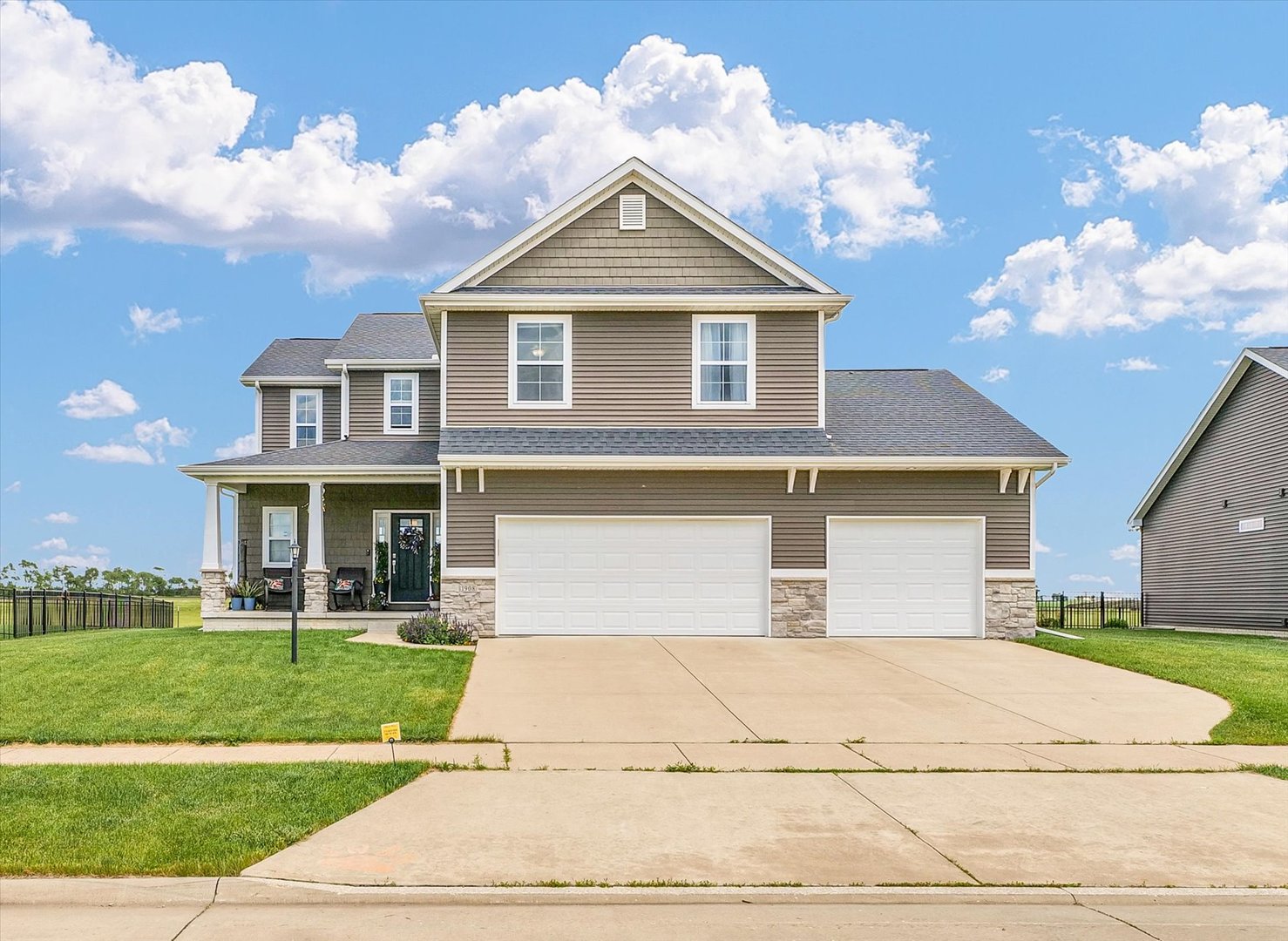 1908 Littlefield Lane Mahomet, IL 61853 - Photo 2 of 51 a front view of a house with a yard