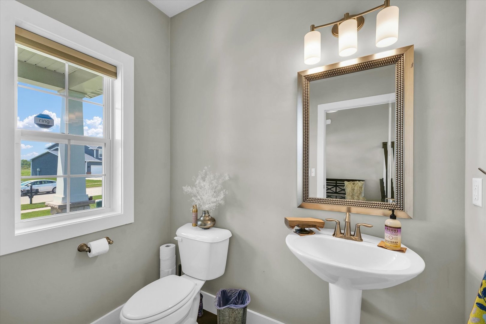 1908 Littlefield Lane Mahomet, IL 61853 - Photo 21 of 51 a bathroom with a toilet sink and mirror