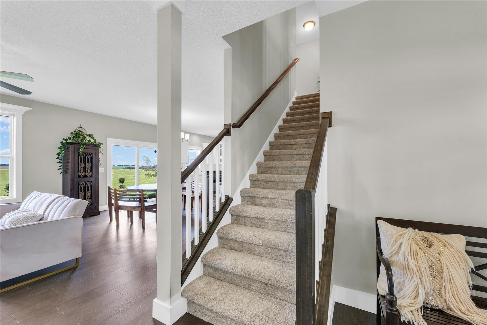 1908 Littlefield Lane Mahomet, IL 61853 - Photo 24 of 51 a view of staircase with wooden floor and a rug