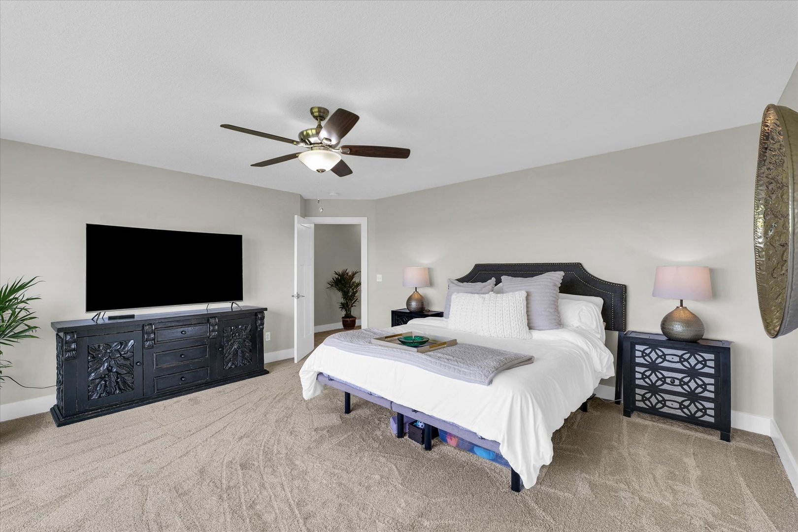 1908 Littlefield Lane Mahomet, IL 61853 - Photo 26 of 51 a spacious bedroom with a bed and a flat screen tv