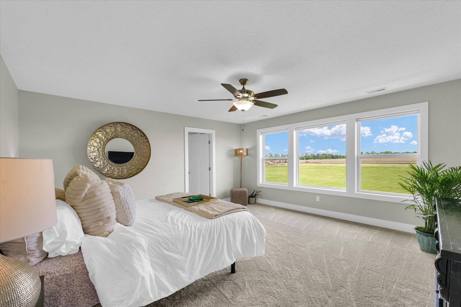 1908 Littlefield Lane Mahomet, IL 61853 - Photo 27 of 51 a bedroom with a large bed and a large window