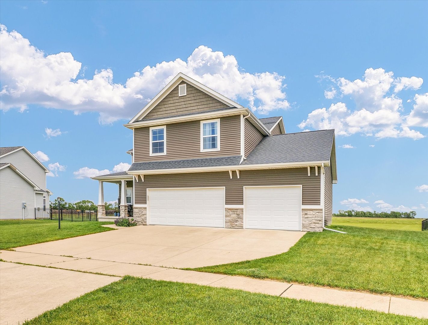 1908 Littlefield Lane Mahomet, IL 61853 - Photo 3 of 51 a front view of a house with a yard