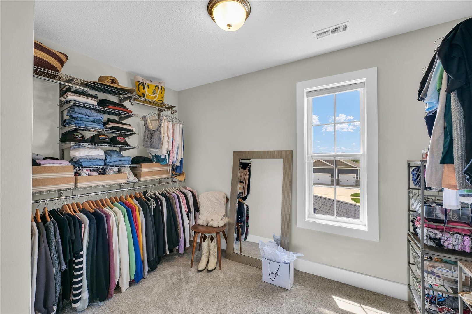 1908 Littlefield Lane Mahomet, IL 61853 - Photo 31 of 51 a view of walk in closet with clothes and shoes